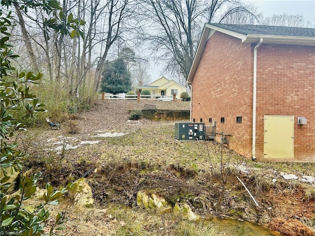 view of yard featuring central AC