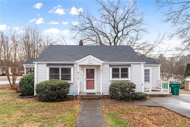 bungalow with a front yard