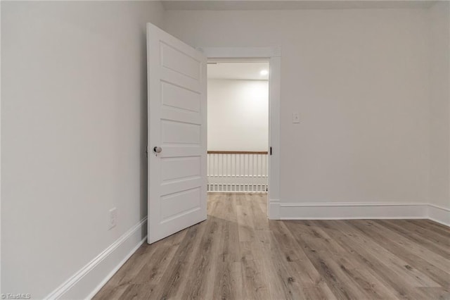 unfurnished room with light hardwood / wood-style flooring