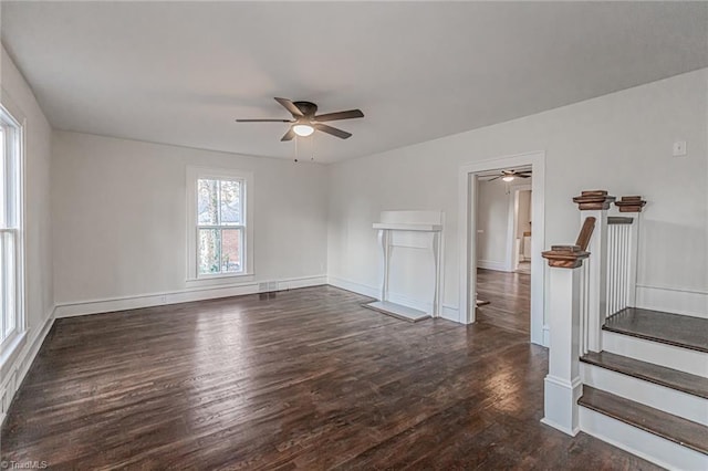 unfurnished room featuring dark wood-type flooring and ceiling fan