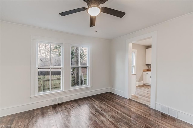 unfurnished room featuring dark wood-type flooring