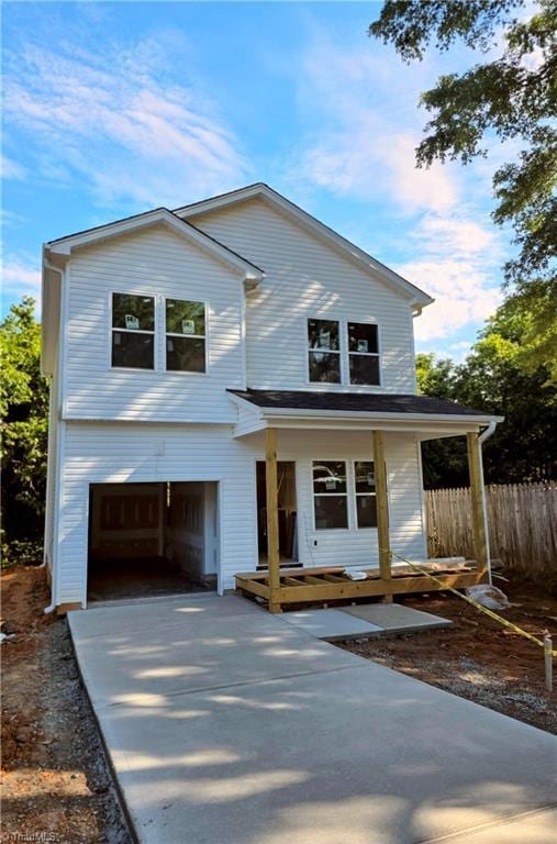 2647 Reid St, Winston-Salem, NC 27107 - view of front of home with a garage, concrete driveway, and a porch