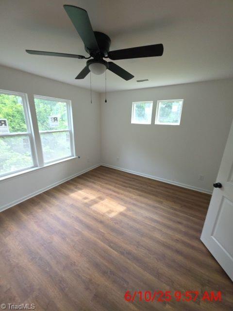 2647 Reid St, Winston-Salem, NC 27107 - spare room featuring dark wood-style flooring and a ceiling fan