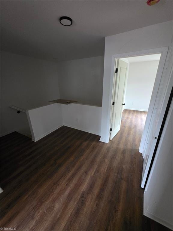 2647 Reid St, Winston-Salem, NC 27107 - spare room with dark wood-type flooring and baseboards