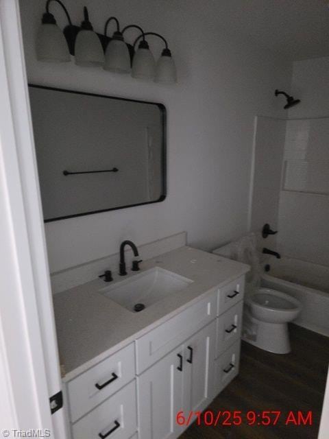 2647 Reid St, Winston-Salem, NC 27107 - full bathroom with vanity, wood finished floors, and shower / bath combination