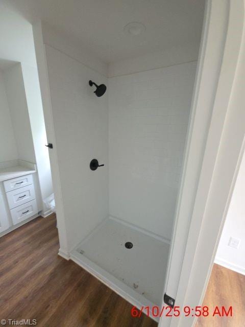 2647 Reid St, Winston-Salem, NC 27107 - full bathroom with a stall shower and wood finished floors