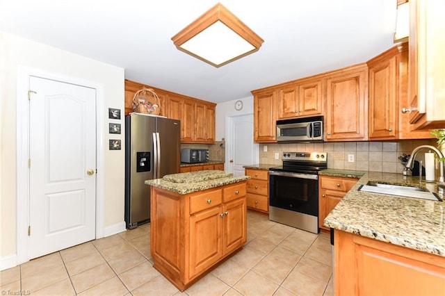 226 Marshview Cir, Angier, NC 27501 - kitchen with decorative backsplash, a sink, appliances with stainless steel finishes, and light tile patterned flooring