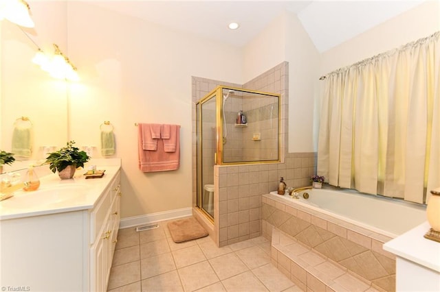 226 Marshview Cir, Angier, NC 27501 - bathroom with tile patterned floors, visible vents, vanity, a garden tub, and a stall shower