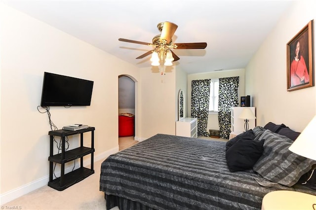 226 Marshview Cir, Angier, NC 27501 - bedroom with arched walkways, carpet, baseboards, and ceiling fan
