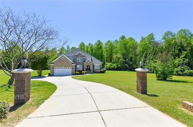 226 Marshview Cir, Angier, NC 27501 - view of front of house with concrete driveway, an attached garage, and a front yard