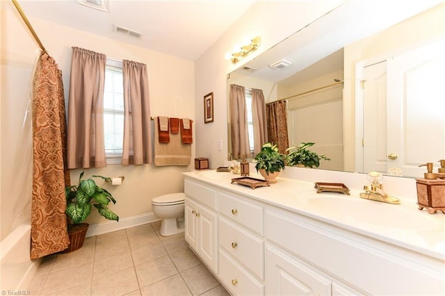 226 Marshview Cir, Angier, NC 27501 - bathroom with a sink, toilet, baseboards, visible vents, and tile patterned flooring