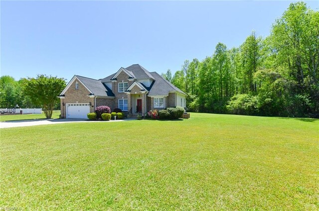 226 Marshview Cir, Angier, NC 27501 - craftsman house with an attached garage, driveway, stone siding, and a front yard