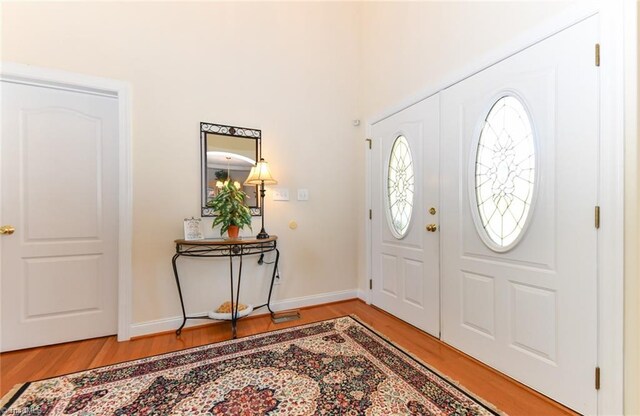 226 Marshview Cir, Angier, NC 27501 - foyer with light wood finished floors and baseboards