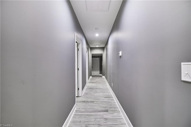 corridor with light wood-type flooring