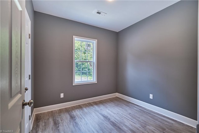 spare room featuring hardwood / wood-style floors