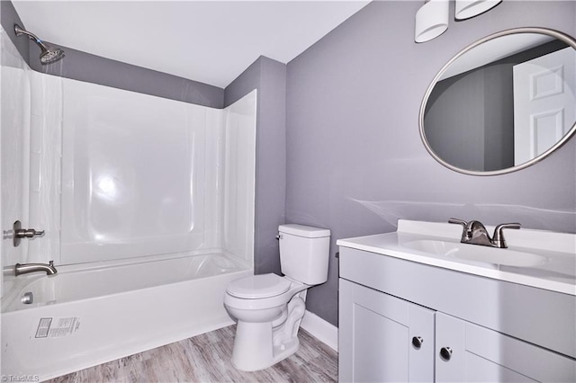 full bathroom with toilet, wood-type flooring, vanity, and bathing tub / shower combination