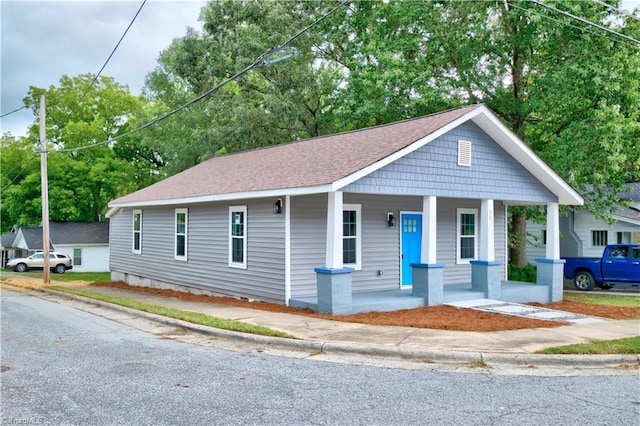 bungalow-style house featuring covered porch