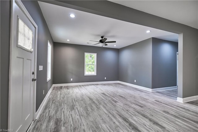 interior space with ceiling fan and light wood-type flooring