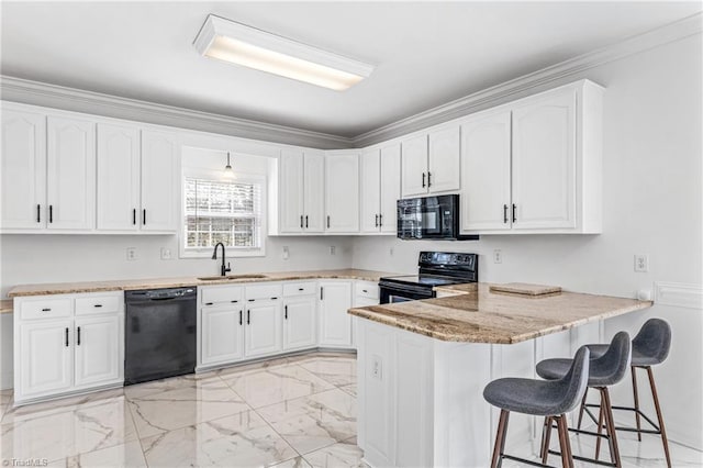 kitchen with sink, a breakfast bar, black appliances, white cabinets, and kitchen peninsula