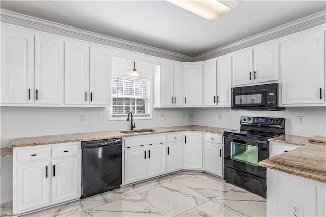 kitchen featuring pendant lighting, sink, white cabinetry, light stone counters, and black appliances