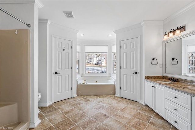 bathroom with vanity, ornamental molding, toilet, and a bathing tub