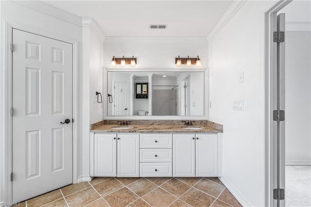 bathroom featuring vanity, tile patterned flooring, and crown molding