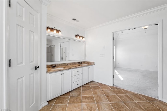 bathroom with vanity, crown molding, and tile patterned floors