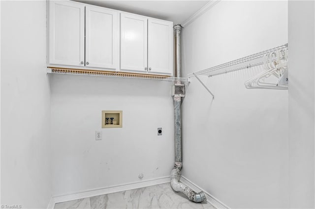 laundry room featuring electric dryer hookup, washer hookup, ornamental molding, and cabinets