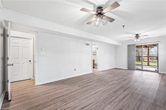 unfurnished living room featuring hardwood / wood-style flooring and ceiling fan