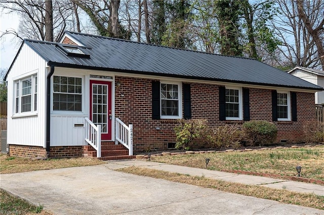 view of front facade featuring crawl space, metal roof, and entry steps