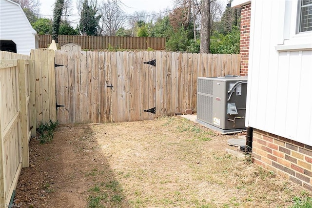 view of yard featuring cooling unit and a fenced backyard