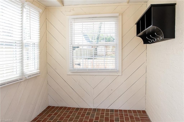 spare room with brick floor