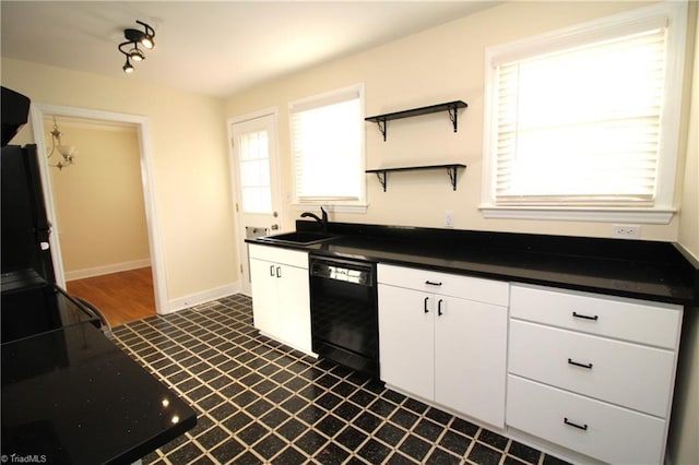 kitchen featuring a sink, black dishwasher, dark countertops, and white cabinets