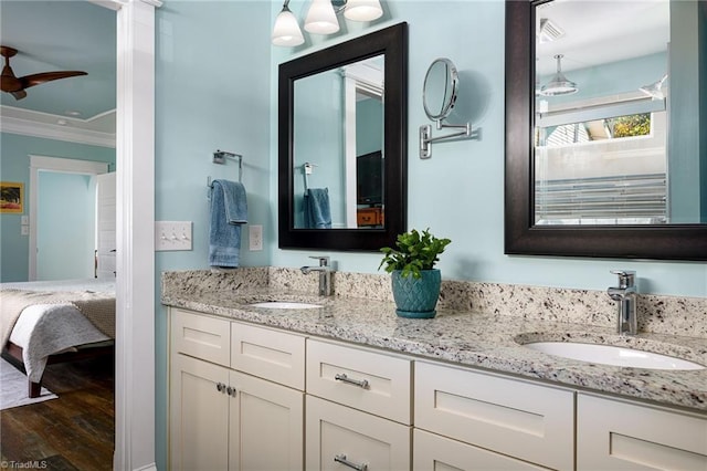 26 Vintage Ave, Winston-Salem, NC 27127 - bathroom with wood finished floors, ceiling fan, a sink, and ornamental molding