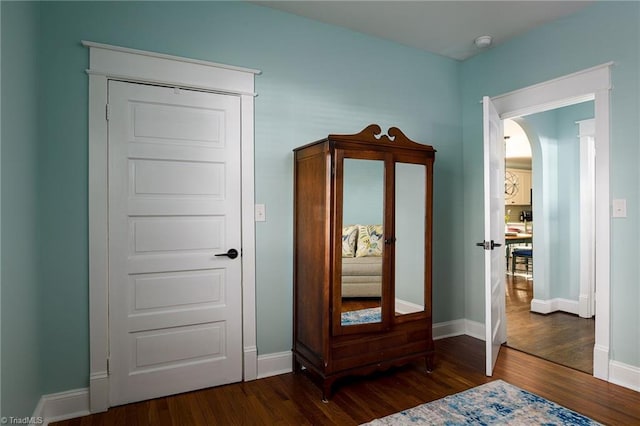 26 Vintage Ave, Winston-Salem, NC 27127 - interior space with dark wood-type flooring, baseboards, and arched walkways