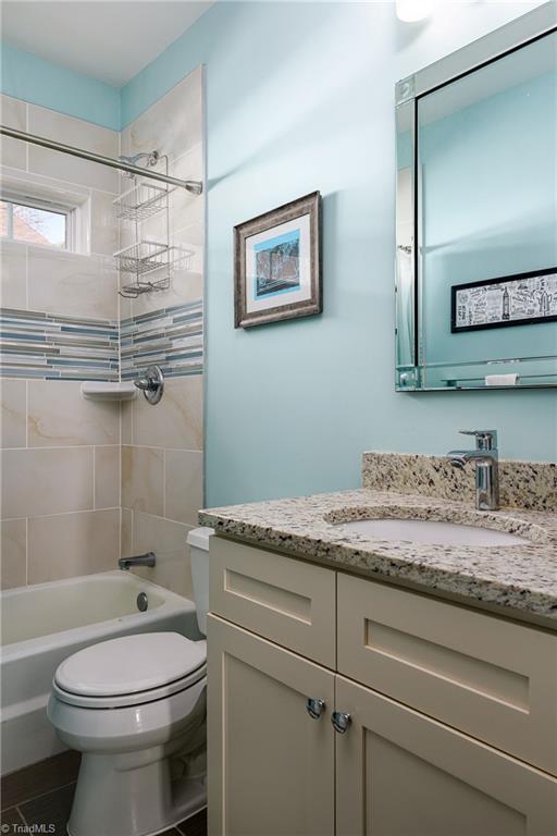 26 Vintage Ave, Winston-Salem, NC 27127 - full bathroom featuring toilet, shower / bathing tub combination, and vanity