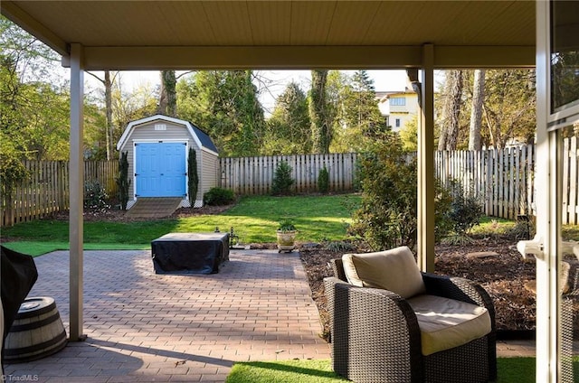 26 Vintage Ave, Winston-Salem, NC 27127 - view of patio / terrace with an outbuilding, a storage unit, and a fenced backyard