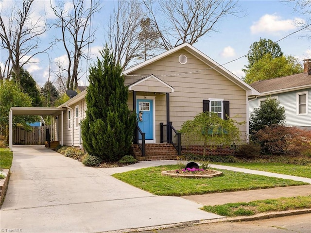 26 Vintage Ave, Winston-Salem, NC 27127 - bungalow-style home featuring a front yard, an attached carport, and concrete driveway