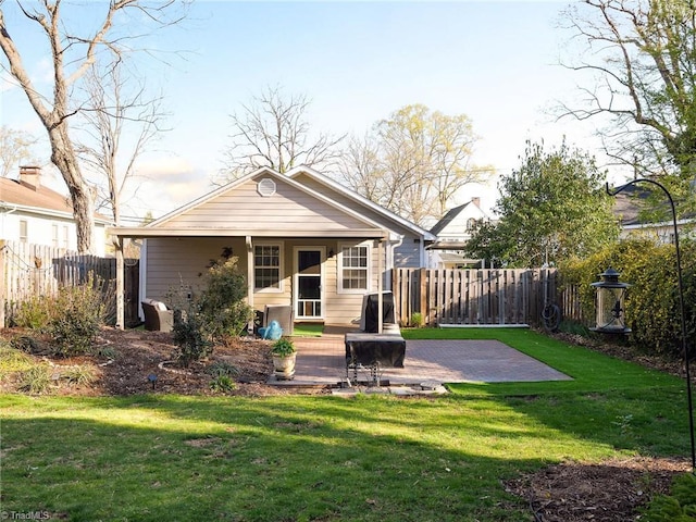 26 Vintage Ave, Winston-Salem, NC 27127 - rear view of property featuring fence, a patio, and a lawn