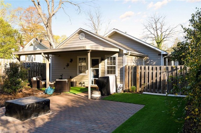 26 Vintage Ave, Winston-Salem, NC 27127 - rear view of property with a patio area, fence, and a lawn