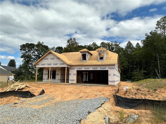 unfinished property featuring an attached garage