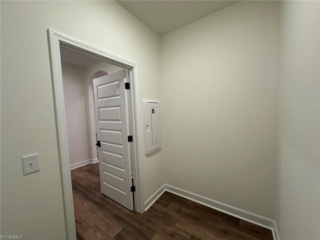 interior space with dark wood-style floors and baseboards