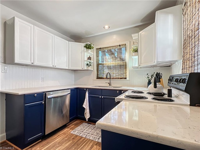 kitchen featuring electric range, open shelves, a sink, stainless steel dishwasher, and blue cabinets