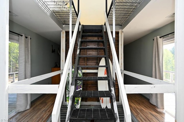 stairway featuring wood finished floors