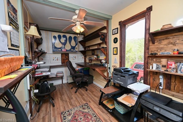 office space featuring wood finished floors and ceiling fan