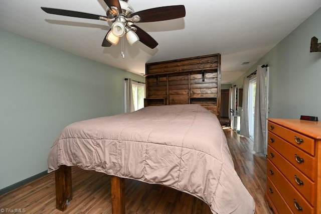 bedroom featuring a ceiling fan and wood finished floors