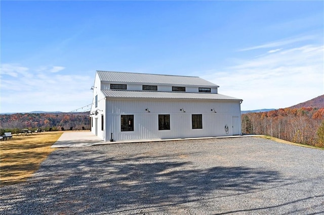 rear view of house with a mountain view