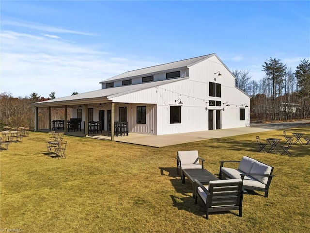 rear view of house with a lawn