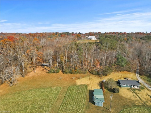 birds eye view of property with a rural view