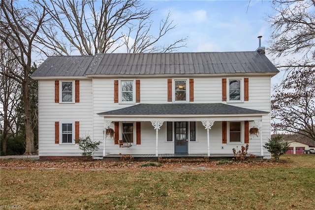 view of front of property featuring a front lawn and a porch